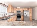 Light wood kitchen cabinets, stainless steel appliances at 2650 W Union Hills Dr # 231, Phoenix, AZ 85027