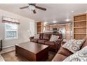Living room with brown couches, coffee table, and kitchen view at 2650 W Union Hills Dr # 231, Phoenix, AZ 85027