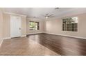 Spacious living room with tile and wood flooring, and a view to the stairs at 2977 E Teakwood Pl, Chandler, AZ 85249