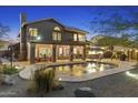 Expansive backyard oasis featuring a sparkling pool and a relaxing patio area at 30639 N 46Th N Pl, Cave Creek, AZ 85331