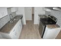 Modern kitchen with granite countertops and stainless steel appliances at 327 W Fairhaven Rd, Kearny, AZ 85137