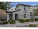 Two-story stucco home with arched entryway and landscaping at 3910 E Turley St, Gilbert, AZ 85295