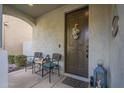 Cozy front porch with two wicker chairs and a small table at 3910 E Turley St, Gilbert, AZ 85295
