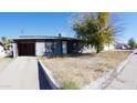 Ranch style home with carport and mature landscaping at 422 W Jamestown Rd, Kearny, AZ 85137