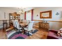 Formal dining room featuring a wood table and hardwood floors at 4264 S Columbine Way, Gold Canyon, AZ 85118