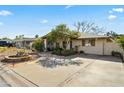 Well-maintained home with a spacious driveway and desert landscaping at 4301 E Montecito Ave, Phoenix, AZ 85018