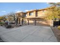 Attractive two-story home with a three-car garage and well-maintained landscaping at 6102 E Sonoran Trl, Scottsdale, AZ 85266