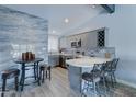 Modern kitchen with white quartz countertops and gray cabinets at 10851 N Fairway E Ct, Sun City, AZ 85351