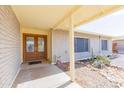 Inviting front porch with decorative double doors and low maintenance desert landscaping at 14019 N 51St Dr, Glendale, AZ 85306