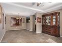 Formal dining room featuring tile floors and elegant chandelier at 15138 W Fillmore St, Goodyear, AZ 85338