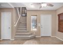 Bright entryway with staircase and tile flooring at 15138 W Fillmore St, Goodyear, AZ 85338