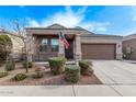 Single-story home with two-car garage and landscaped yard at 1631 N Beverly --, Mesa, AZ 85201