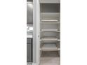 White pantry with pull-out shelves offering ample storage space at 1631 N Beverly --, Mesa, AZ 85201