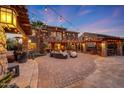 Outdoor patio with string lights, seating area, and a view of the home at 18212 W East Wind Ave, Goodyear, AZ 85338