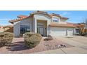 Beautiful two-story home with a three-car garage and desert landscaping at 18239 N 46Th St, Phoenix, AZ 85032