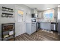 Well-lit kitchen featuring stainless steel appliances and modern cabinetry at 1865 W 3Rd Pl, Mesa, AZ 85201