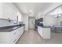 Modern kitchen with white shaker cabinets and dark countertops at 2008 W Campbell Ave, Phoenix, AZ 85015