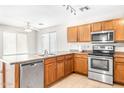 Kitchen with stainless steel appliances and wood cabinets at 2119 W Vineyard Plains Dr, San Tan Valley, AZ 85144