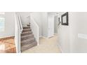 Carpeted staircase leading to the upper level at 2119 W Vineyard Plains Dr, San Tan Valley, AZ 85144