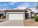 Single-story house with a two-car garage and desert landscaping at 21362 E Puesta Del Sol Rd, Queen Creek, AZ 85142