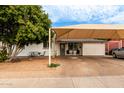 Ranch style home with carport and landscaped front yard at 2206 W Glendale Ave, Phoenix, AZ 85021