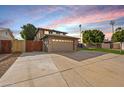 Two-story house with a gated driveway and attached garage at 2238 S Estrella Cir, Mesa, AZ 85202