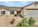 House exterior showcasing a garage and walkway at 22667 N 30Th Ave, Phoenix, AZ 85027