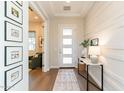 Bright and airy entryway with a marble console table at 23071 N 98Th Dr, Peoria, AZ 85383