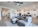 Open concept living with a view of the kitchen, dining area, and large comfortable couch at 23933 N 167Th Ln, Surprise, AZ 85387