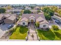 Expansive aerial view showcasing the property's beautiful landscaping, tile roof, and peaceful neighborhood at 2939 E Huber St, Mesa, AZ 85213