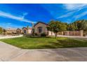 Well-manicured lawn with mature trees and landscaping creating curb appeal for this lovely home at 2939 E Huber St, Mesa, AZ 85213