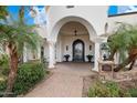 Ornate entryway with a grand arched doorway and stone accents at 3447 E Kenwood St, Mesa, AZ 85213