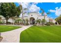 Elegant home with a welcoming entryway and a beautifully landscaped yard at 3447 E Kenwood St, Mesa, AZ 85213