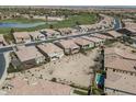 Community overview featuring golf course and lake views at 36168 N Stoneware Dr, Queen Creek, AZ 85140