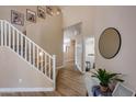 Elegant staircase with white railings and hardwood floors at 3639 E San Pedro Ave, Gilbert, AZ 85234