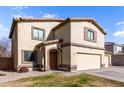 Two-story house with a two-car garage and desert landscaping at 4322 E Whitehall Dr, San Tan Valley, AZ 85140