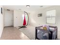 Bright living room featuring tile floors and a baby play area at 4322 E Whitehall Dr, San Tan Valley, AZ 85140