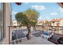 Private balcony overlooking parking lot with views of surrounding buildings at 455 S Delaware Dr # 154, Apache Junction, AZ 85120