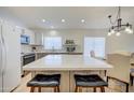 Open concept kitchen with large island and white quartz countertops at 5153 W Pontiac Dr, Glendale, AZ 85308