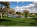 Landscaped green space with pond and fountain at 5251 W Posse Dr, Eloy, AZ 85131