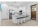 Bright kitchen featuring white cabinets, stainless steel appliances, and a breakfast bar at 5724 S Coyote Cyn, Mesa, AZ 85212