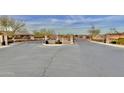 Gated community entrance with stone pillars and signage at 5836 S 58Th Gln, Laveen, AZ 85339