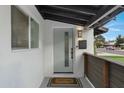 Modern front entrance with a stylish door and welcoming mat at 8314 E Clarendon Ave, Scottsdale, AZ 85251