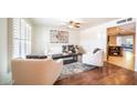 Bright living room with hardwood floors, comfy seating, and a view of the kitchen at 8514 E Fairmount Ave, Scottsdale, AZ 85251