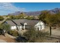 House with mountain views and desert landscaping at 9546 E Anasazi Pl, Gold Canyon, AZ 85118