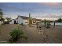 Backyard patio with desert landscaping and built-in BBQ at 9546 E Anasazi Pl, Gold Canyon, AZ 85118