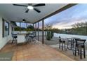 Covered patio with seating area and mountain views at 9546 E Anasazi Pl, Gold Canyon, AZ 85118