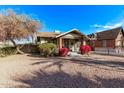 House exterior with red flowers and gravel yard at 1002 E Palm Ln, Phoenix, AZ 85006