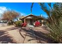 Front view of a house with walkway and palm trees at 1002 E Palm Ln, Phoenix, AZ 85006