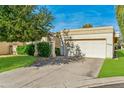 House exterior showing front entrance and garage at 10546 E Topaz Cir, Scottsdale, AZ 85258